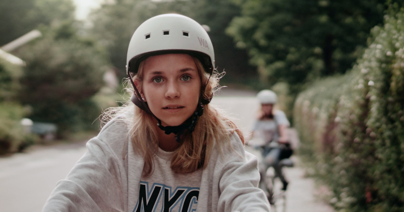 closeup of teenager riding a bike