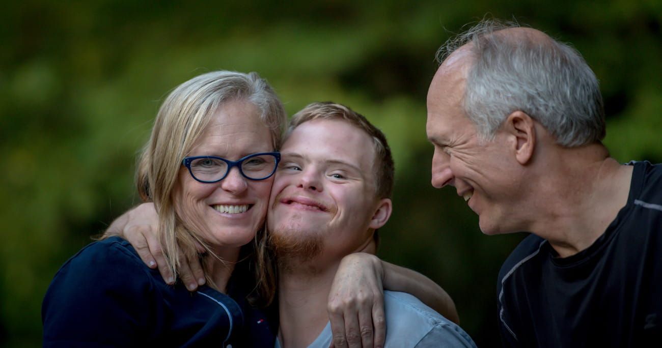 disabled adult with his parents