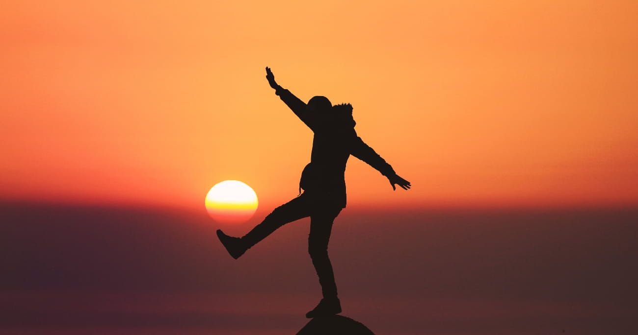 silhouette of a person balancing